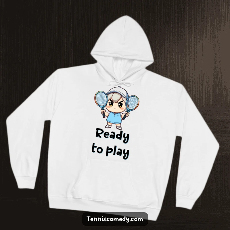 Funny hoodie with a determined kawaii character holding two tennis rackets, ready to conquer the court and cold weather.