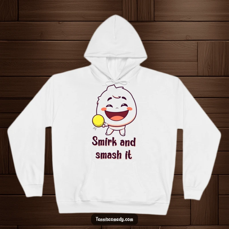 Funny hoodie with a character smirking playfully while hitting a tennis ball towards an enormous smile, perfect for a funny tennis fan.